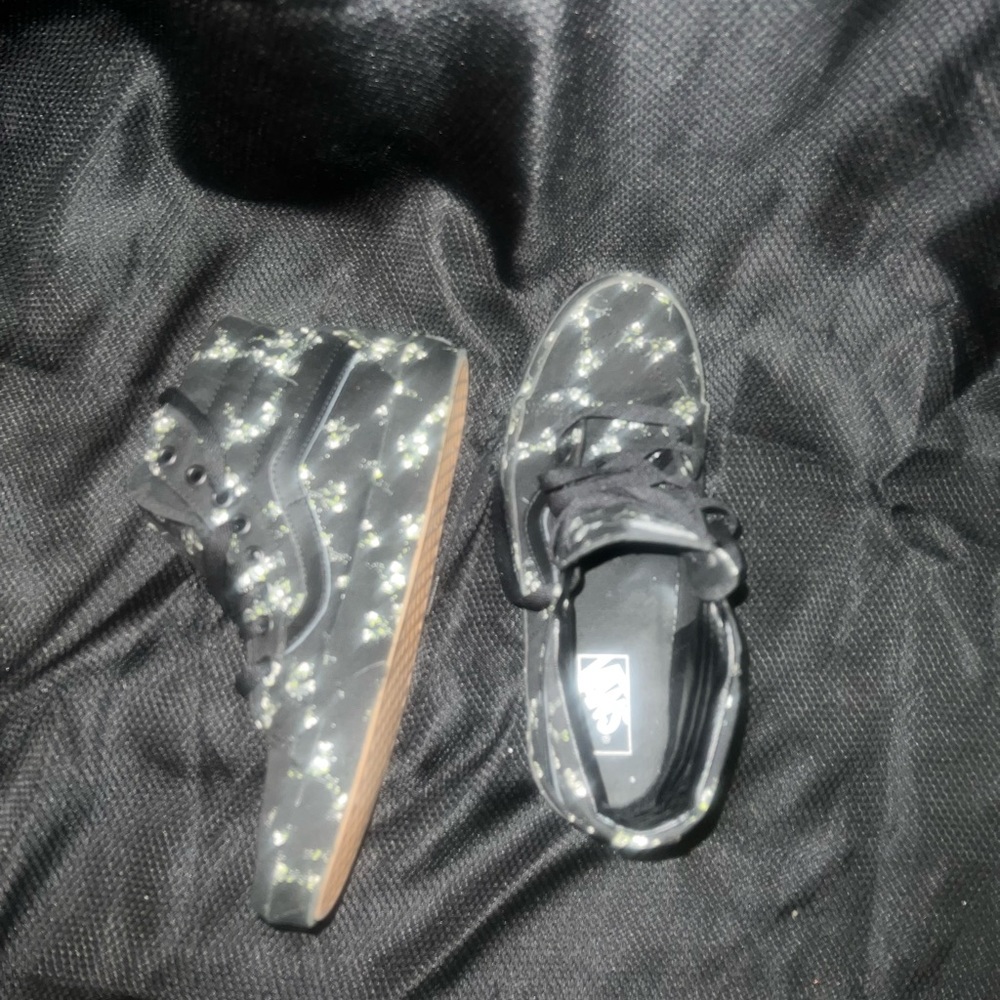 Black with white floral print Vans…